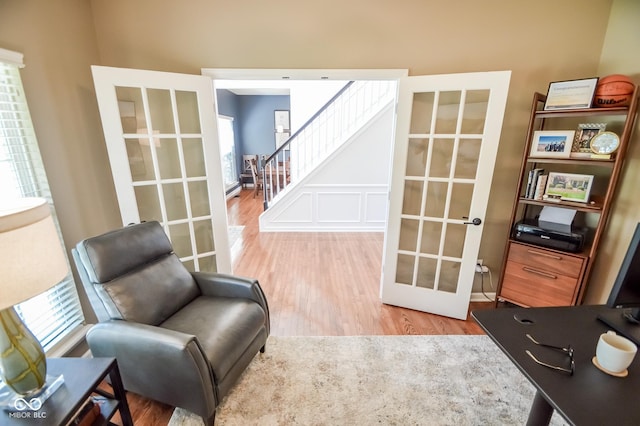 6802 Chorleywood Cir, Indianapolis, IN 46259 - living area featuring french doors, wood finished floors, and stairway