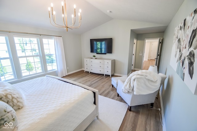 6802 Chorleywood Cir, Indianapolis, IN 46259 - bedroom featuring wood finished floors, a chandelier, and lofted ceiling