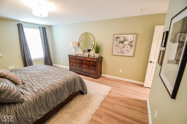 6802 Chorleywood Cir, Indianapolis, IN 46259 - bedroom featuring light wood finished floors and baseboards