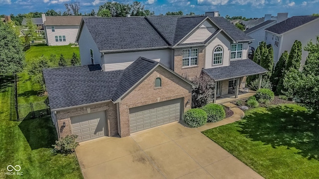 6802 Chorleywood Cir, Indianapolis, IN 46259 - traditional-style home featuring brick siding, covered porch, a shingled roof, and driveway