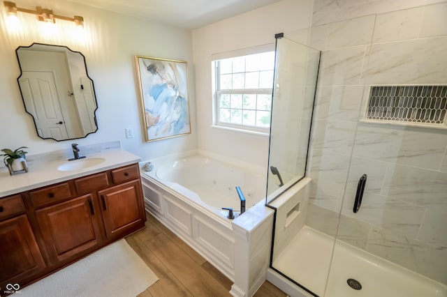 6802 Chorleywood Cir, Indianapolis, IN 46259 - full bath featuring a tub with jets, a stall shower, vanity, and wood finished floors