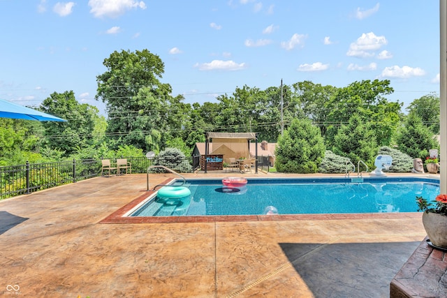 5052 Sherwood Ct, Pittsboro, IN 46167 - view of pool with a patio area and view of wooded area