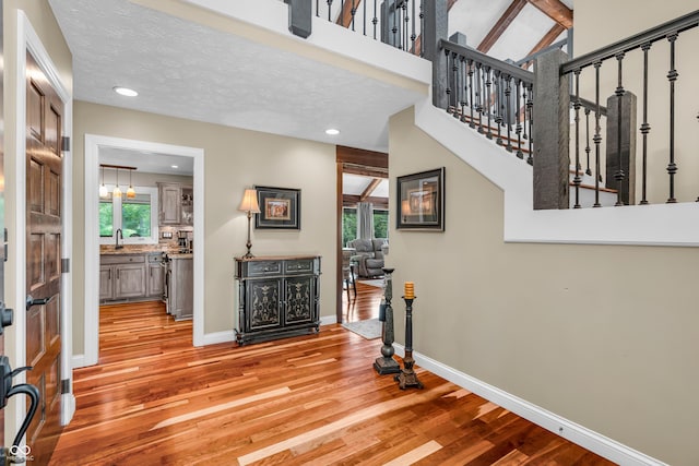 5052 Sherwood Ct, Pittsboro, IN 46167 - entrance foyer with light wood-style flooring, recessed lighting, and stairway
