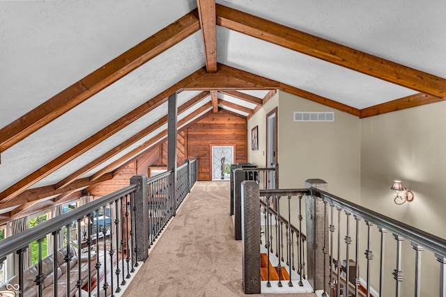 5052 Sherwood Ct, Pittsboro, IN 46167 - corridor featuring an upstairs landing, wood walls, and light carpet