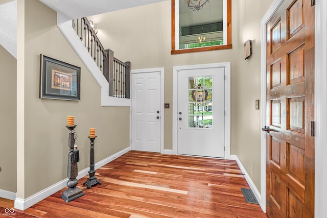 5052 Sherwood Ct, Pittsboro, IN 46167 - entrance foyer with light wood-type flooring and a high ceiling