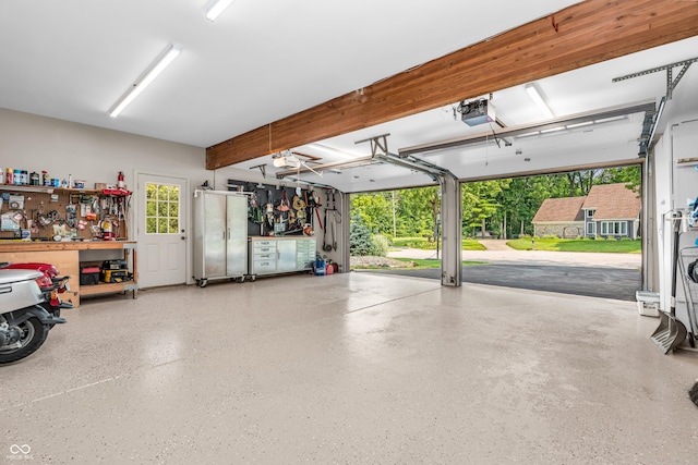 5052 Sherwood Ct, Pittsboro, IN 46167 - garage with a garage door opener and a workshop area