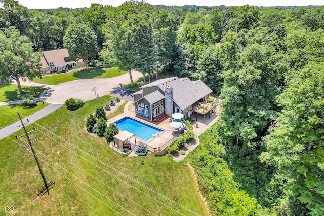 5052 Sherwood Ct, Pittsboro, IN 46167 - aerial view of property and surrounding area with a pool and a heavily wooded area