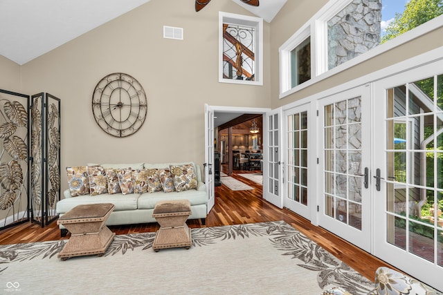 5052 Sherwood Ct, Pittsboro, IN 46167 - living room with french doors, wood finished floors, high vaulted ceiling, and ceiling fan