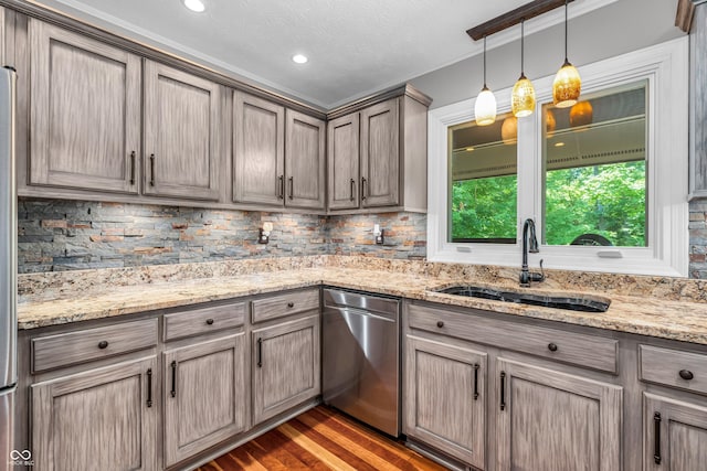 5052 Sherwood Ct, Pittsboro, IN 46167 - kitchen with stainless steel dishwasher, decorative backsplash, wood finished floors, hanging light fixtures, and recessed lighting