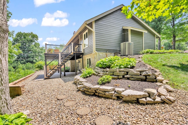 5052 Sherwood Ct, Pittsboro, IN 46167 - rear view of property with stairway, a deck, and stone siding