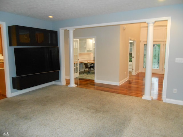 7653 W Old Colony Dr, New Palestine, IN 46163 - unfurnished living room featuring carpet flooring, decorative columns, and recessed lighting
