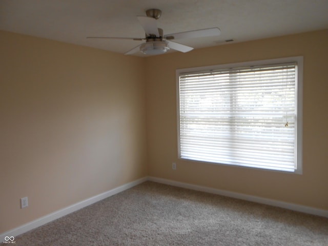 7653 W Old Colony Dr, New Palestine, IN 46163 - carpeted empty room with ceiling fan and plenty of natural light