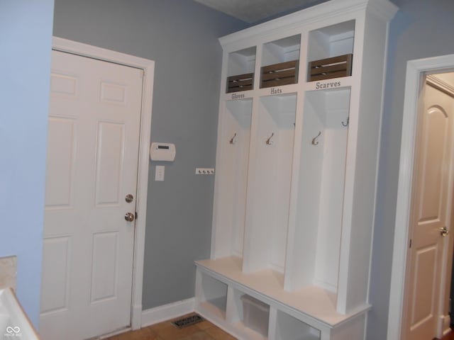 7653 W Old Colony Dr, New Palestine, IN 46163 - mudroom featuring baseboards