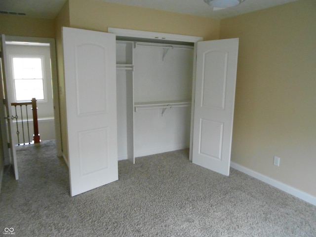 7653 W Old Colony Dr, New Palestine, IN 46163 - unfurnished bedroom featuring carpet floors and a closet