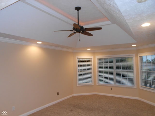 7653 W Old Colony Dr, New Palestine, IN 46163 - carpeted spare room with a tray ceiling, recessed lighting, a ceiling fan, and ornamental molding
