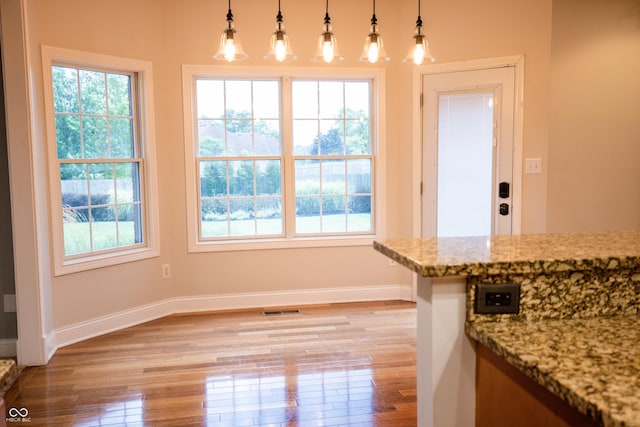 7653 W Old Colony Dr, New Palestine, IN 46163 - unfurnished dining area with light wood finished floors and baseboards