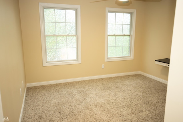 7653 W Old Colony Dr, New Palestine, IN 46163 - carpeted empty room featuring baseboards and ceiling fan