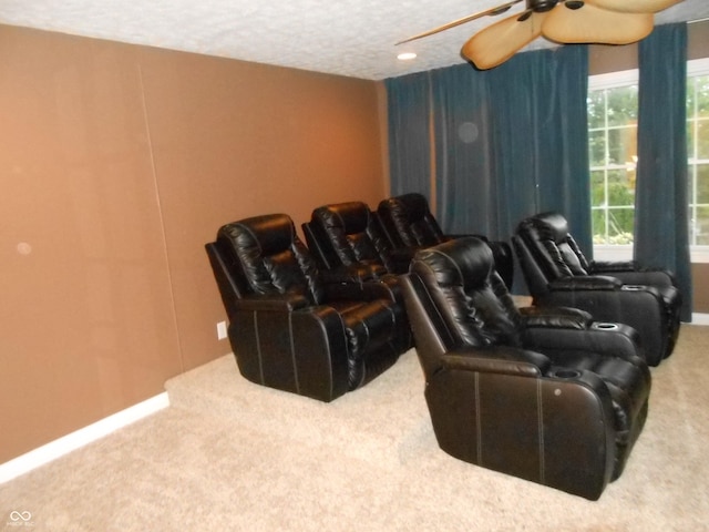 7653 W Old Colony Dr, New Palestine, IN 46163 - cinema room featuring carpet flooring, ceiling fan, and a textured ceiling