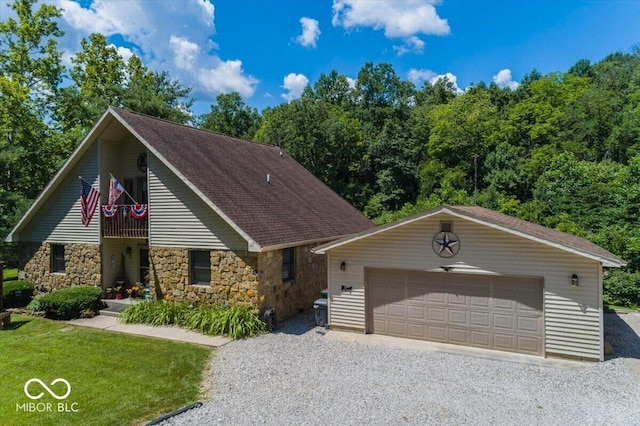 8546 N Chickadee Dr, Morgantown, IN 46160 - view of front of house featuring stone siding, an outbuilding, a balcony, and a detached garage