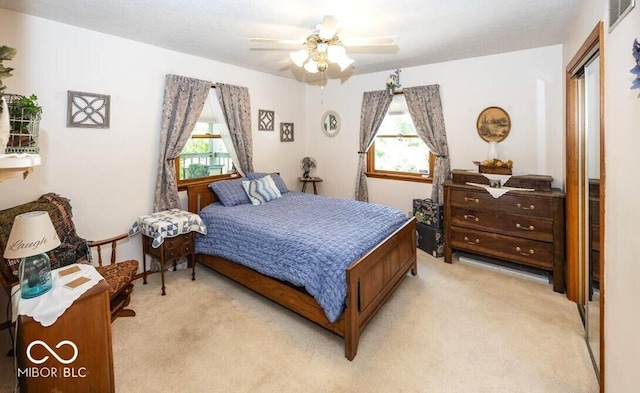 8546 N Chickadee Dr, Morgantown, IN 46160 - bedroom with light colored carpet, a closet, and ceiling fan