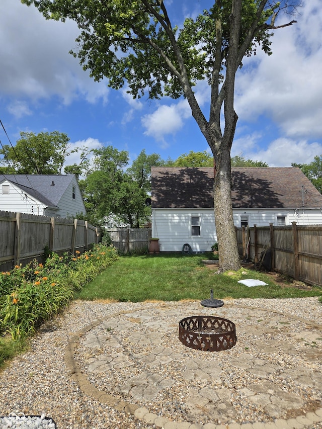2311 Gilmore St, Columbus, IN 47201 - fenced backyard with a fire pit