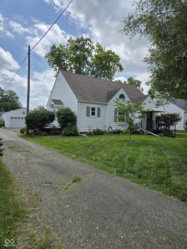 2311 Gilmore St, Columbus, IN 47201 - view of front of home featuring a front yard and a shingled roof
