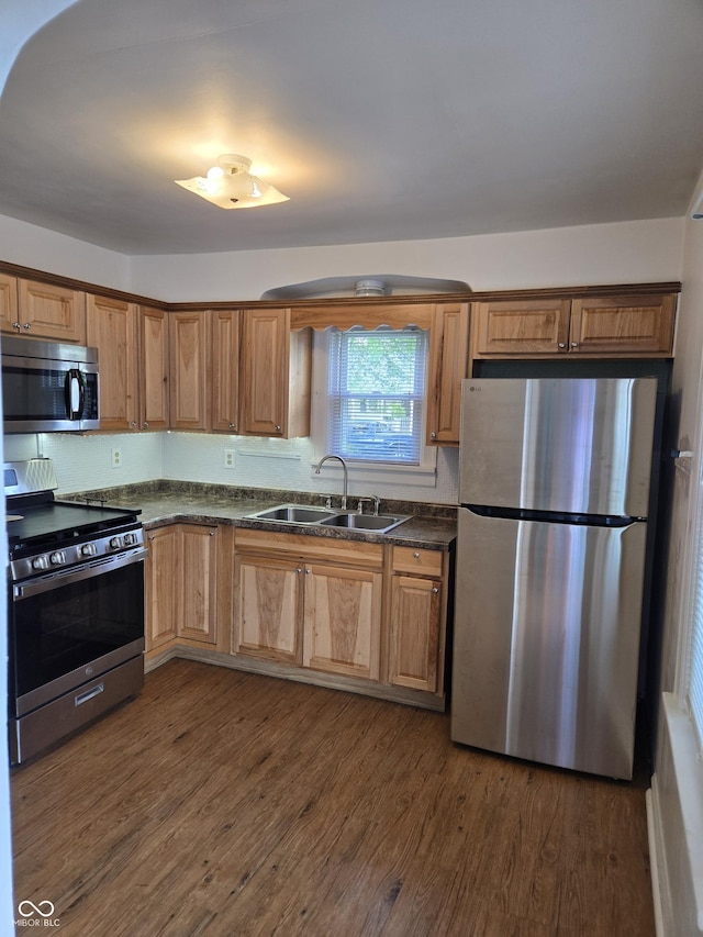 2311 Gilmore St, Columbus, IN 47201 - kitchen featuring appliances with stainless steel finishes, dark countertops, and dark wood-style floors