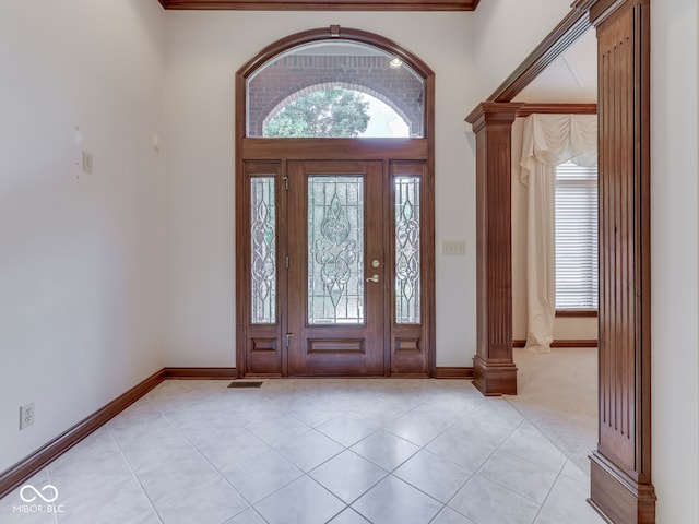 2025 Caledonian Ct, Greenwood, IN 46143 - foyer featuring decorative columns and light tile patterned flooring