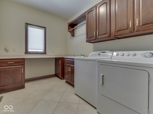 2025 Caledonian Ct, Greenwood, IN 46143 - washroom featuring cabinet space, independent washer and dryer, and light tile patterned floors