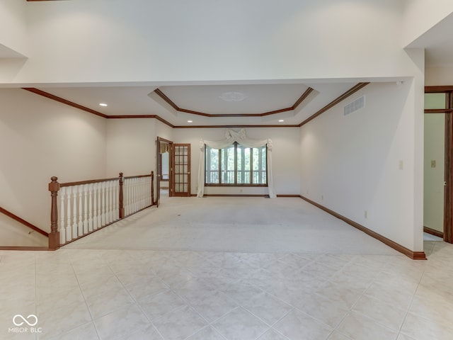 2025 Caledonian Ct, Greenwood, IN 46143 - carpeted spare room featuring a tray ceiling, ornamental molding, and recessed lighting