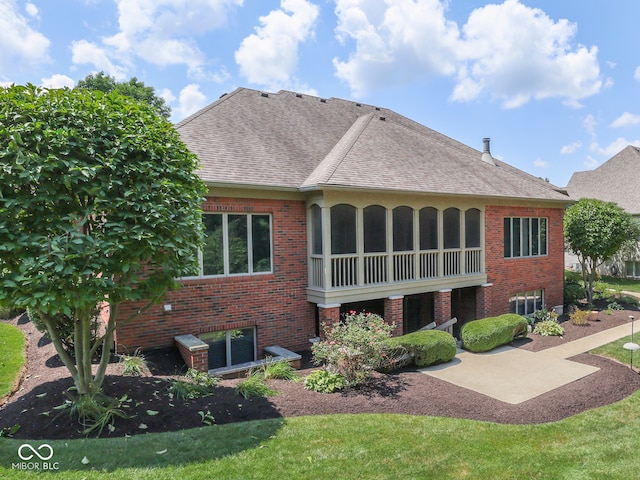2025 Caledonian Ct, Greenwood, IN 46143 - back of property featuring brick siding, a shingled roof, and a patio