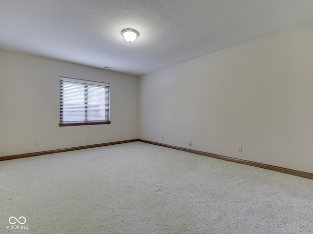 2025 Caledonian Ct, Greenwood, IN 46143 - unfurnished room featuring baseboards and light carpet