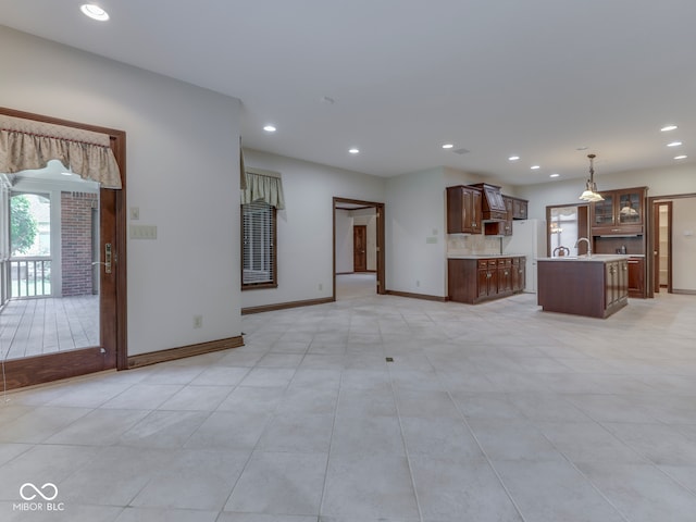 2025 Caledonian Ct, Greenwood, IN 46143 - unfurnished living room with recessed lighting and light tile patterned flooring