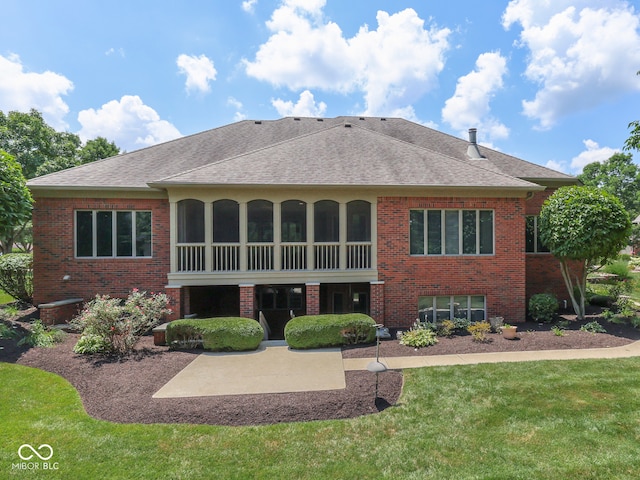 2025 Caledonian Ct, Greenwood, IN 46143 - rear view of house featuring brick siding, a lawn, roof with shingles, and a patio