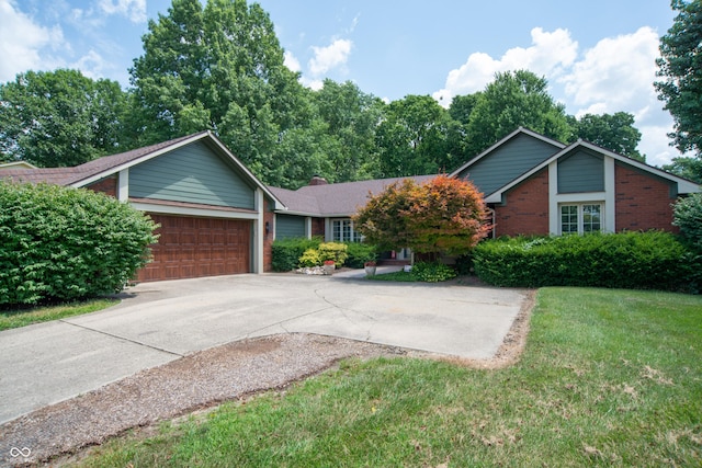 8841 Rocky Ridge Rd, Indianapolis, IN 46217 - ranch-style home with a garage, brick siding, concrete driveway, a front lawn, and a chimney