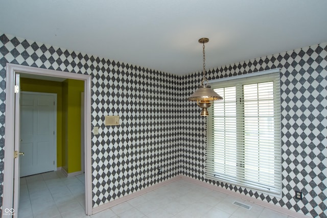 8841 Rocky Ridge Rd, Indianapolis, IN 46217 - unfurnished dining area with wallpapered walls and light tile patterned floors