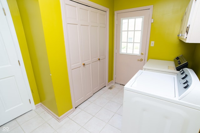 8841 Rocky Ridge Rd, Indianapolis, IN 46217 - laundry area with cabinet space, washing machine and dryer, and light tile patterned floors
