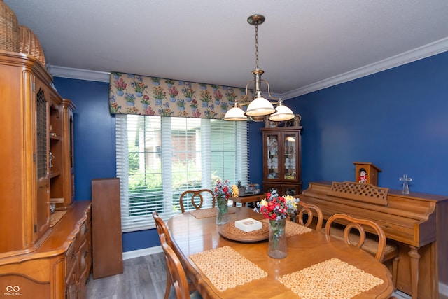 8841 Rocky Ridge Rd, Indianapolis, IN 46217 - dining room featuring crown molding and wood finished floors