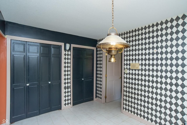 8841 Rocky Ridge Rd, Indianapolis, IN 46217 - unfurnished dining area featuring light tile patterned floors