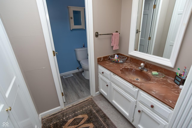 8841 Rocky Ridge Rd, Indianapolis, IN 46217 - bathroom featuring vanity and wood finished floors