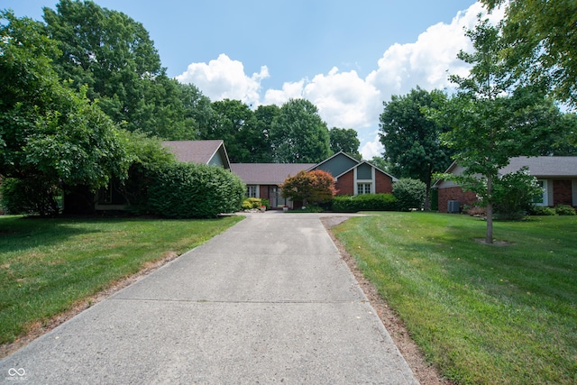 8841 Rocky Ridge Rd, Indianapolis, IN 46217 - view of front of house featuring concrete driveway and a front lawn
