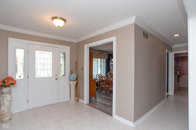 8841 Rocky Ridge Rd, Indianapolis, IN 46217 - entryway with crown molding and light tile patterned floors