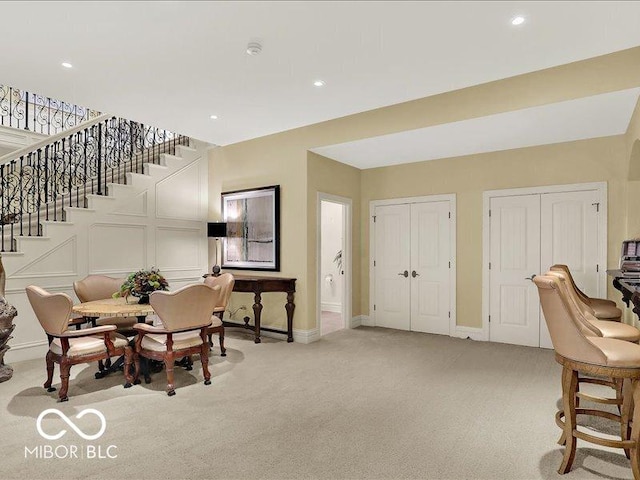 3808 Claybrook Ct, Bargersville, IN 46106 - dining area featuring light colored carpet, stairs, and recessed lighting