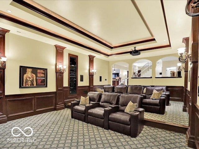 3808 Claybrook Ct, Bargersville, IN 46106 - home theater room with carpet, a raised ceiling, ornate columns, wainscoting, and a decorative wall