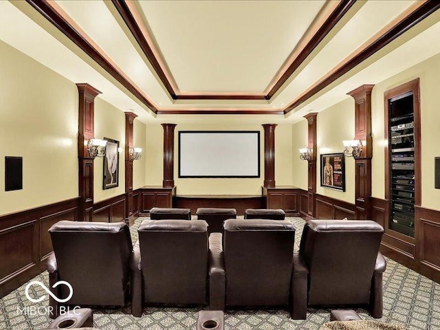 3808 Claybrook Ct, Bargersville, IN 46106 - cinema room with wainscoting, decorative columns, a tray ceiling, a decorative wall, and light colored carpet