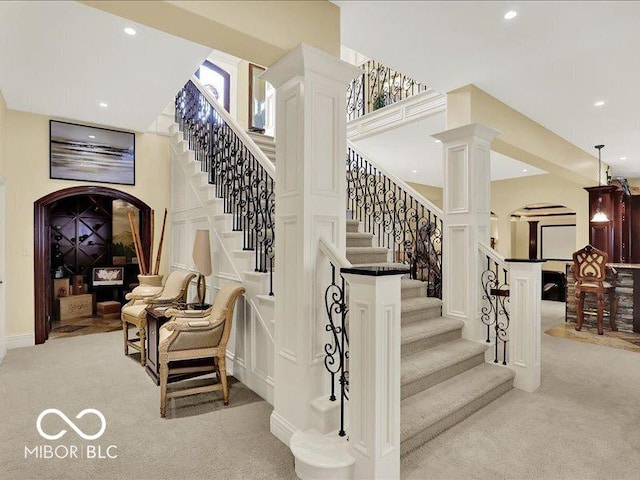 3808 Claybrook Ct, Bargersville, IN 46106 - staircase with carpet flooring, recessed lighting, arched walkways, and decorative columns