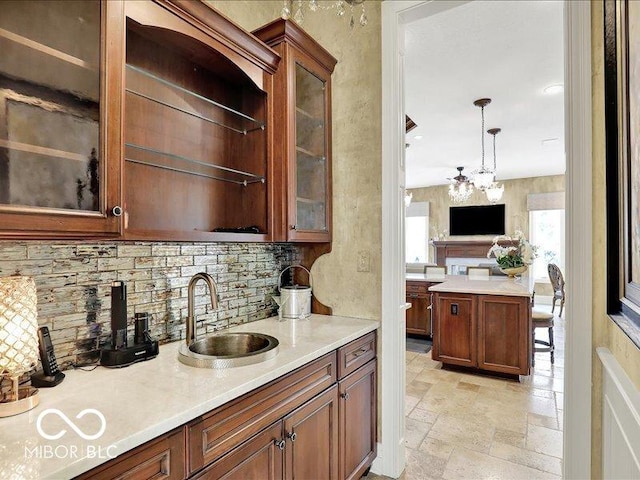 3808 Claybrook Ct, Bargersville, IN 46106 - kitchen with backsplash, light countertops, stone tile floors, and glass insert cabinets