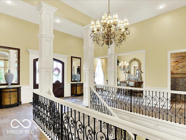 3808 Claybrook Ct, Bargersville, IN 46106 - corridor with a decorative wall, plenty of natural light, a chandelier, a towering ceiling, and an upstairs landing