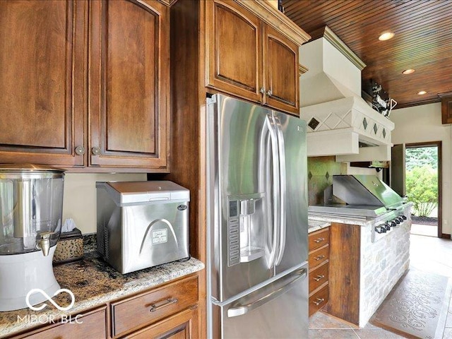 3808 Claybrook Ct, Bargersville, IN 46106 - kitchen with stainless steel fridge, light stone countertops, wood ceiling, brown cabinetry, and recessed lighting