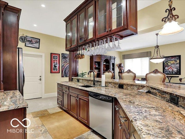 3808 Claybrook Ct, Bargersville, IN 46106 - kitchen featuring appliances with stainless steel finishes, light stone counters, hanging light fixtures, glass insert cabinets, and recessed lighting